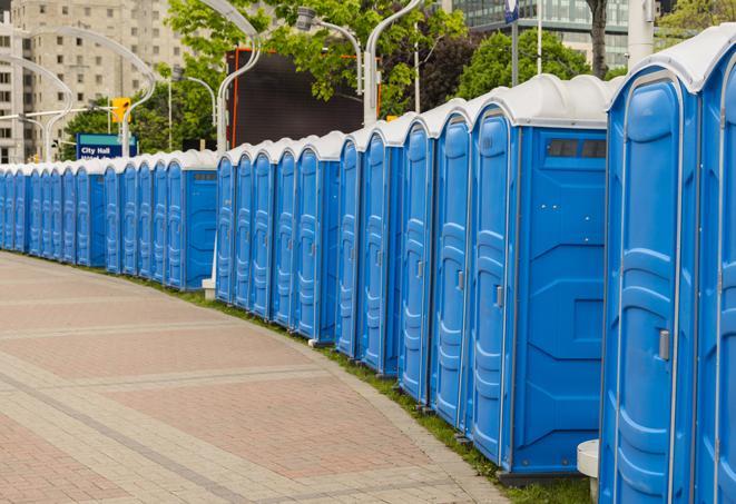 a row of portable restrooms set up for a large athletic event, allowing participants and spectators to easily take care of their needs in Van Nuys CA